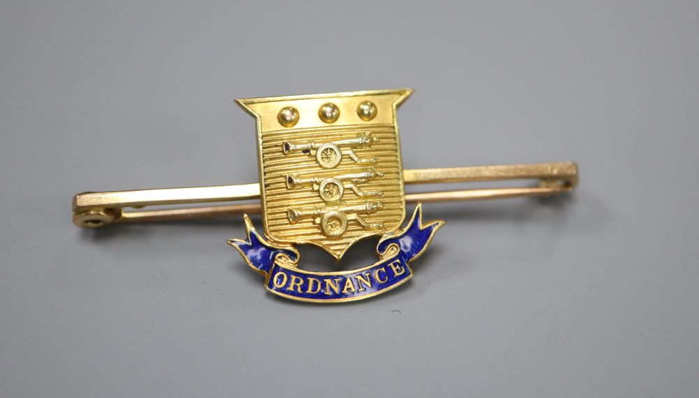 An early 20th century 15ct and enamel Army Ordnance Department bar brooch, 47mm, gross 4.8 grams.